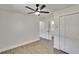 Bright bedroom features new floors, fresh paint, a ceiling fan and closet at 3212 Cork Rd, Plant City, FL 33565