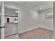 Bright room features light wood flooring, a window, fresh paint and a glimpse of the kitchen at 3212 Cork Rd, Plant City, FL 33565
