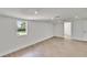 Bright bedroom features new floors, fresh paint, recessed lights and a window at 3212 Cork Rd, Plant City, FL 33565