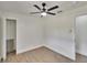 This bedroom features wood floors, a closet, and a modern ceiling fan at 3212 Cork Rd, Plant City, FL 33565