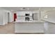 Modern kitchen boasts stainless steel appliances, white cabinets, marble countertops, and breakfast bar at 3212 Cork Rd, Plant City, FL 33565