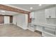 Cozy kitchenette nook featuring a counter top, cabinets and shelving, plus a brick archway at 3212 Cork Rd, Plant City, FL 33565