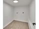 Bright laundry room features wood-look flooring and hookups at 3212 Cork Rd, Plant City, FL 33565