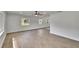 Bright living room features new floors, fresh paint, and large windows at 3212 Cork Rd, Plant City, FL 33565