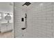 New shower featuring subway tile, a rainfall shower head, and modern fixtures at 3212 Cork Rd, Plant City, FL 33565