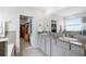 Bathroom with double sink vanity, granite countertops, and walk-in closet at 33675 Elm Hill Br, Wesley Chapel, FL 33545