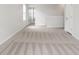 Bedroom showcasing neutral carpet and a view of the hallway at 33675 Elm Hill Br, Wesley Chapel, FL 33545