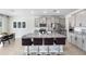 Open-concept kitchen featuring an island with barstool seating, and stainless steel appliances at 33675 Elm Hill Br, Wesley Chapel, FL 33545