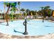 A vibrant splash pad provides a refreshing escape, boasting playful water features and a safe, non-slip surface for  at 33675 Elm Hill Br, Wesley Chapel, FL 33545