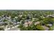 An aerial view of a charming neighborhood showcasing lush greenery, diverse homes, and a vibrant community setting at 3611 W Bay To Bay Blvd, Tampa, FL 33611