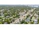 An aerial view of a neighborhood with lush greenery and well-maintained streets, close to the city and waterfront at 3611 W Bay To Bay Blvd, Tampa, FL 33611