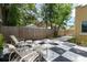 Inviting backyard with a checkered patio, comfortable seating, and lush landscaping at 3611 W Bay To Bay Blvd, Tampa, FL 33611