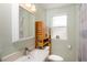 Bathroom featuring a sink vanity and window allowing for natural light at 3611 W Bay To Bay Blvd, Tampa, FL 33611