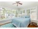 Serene bedroom with large windows and natural light overlooking the backyard at 3611 W Bay To Bay Blvd, Tampa, FL 33611