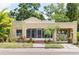 Charming single-story home featuring a stucco exterior, inviting porch, and attached carport for convenient parking at 3611 W Bay To Bay Blvd, Tampa, FL 33611