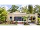 Inviting one-story home with stucco siding, a welcoming porch, and an attached carport for convenient parking at 3611 W Bay To Bay Blvd, Tampa, FL 33611