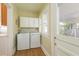 Laundry room includes window and washer and dryer hookups at 3611 W Bay To Bay Blvd, Tampa, FL 33611