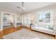 Bright living room featuring hardwood floors, neutral decor, and access to additional living spaces at 3611 W Bay To Bay Blvd, Tampa, FL 33611
