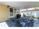 Covered patio area with outdoor seating, perfect for entertaining or relaxing in the shade at 3611 W Bay To Bay Blvd, Tampa, FL 33611