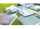 Aerial view of the community center, pool, shuffleboard courts, parking, and community buildings at 36435 Bonney Dr, Zephyrhills, FL 33541