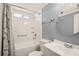 This bathroom features tile shower and tub, vanity, and framed mirror at 36435 Bonney Dr, Zephyrhills, FL 33541