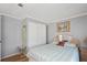 Bedroom features include painted walls, wood-look flooring and double door closet at 36435 Bonney Dr, Zephyrhills, FL 33541