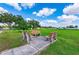 Common area featuring benches under a clear blue sky provides a relaxing space for residents at 36435 Bonney Dr, Zephyrhills, FL 33541