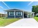 Charming single-story home with a covered carport and well-maintained front yard and visible street address at 36435 Bonney Dr, Zephyrhills, FL 33541