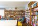 Reading room with floor-to-ceiling bookshelves and a cozy atmosphere at 36435 Bonney Dr, Zephyrhills, FL 33541