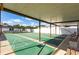 View of covered shuffleboard courts featuring benches and a lush green surface for recreational enjoyment at 36435 Bonney Dr, Zephyrhills, FL 33541