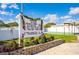 A clubhouse sign adorned with flowers and event information at 36435 Bonney Dr, Zephyrhills, FL 33541