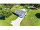 Aerial image of house with shed, above-ground pool, long driveway, and established landscaping at 37113 Waldo Dr, Dade City, FL 33525