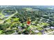 Aerial view of the property in a rural area near lakes and wetlands at 37113 Waldo Dr, Dade City, FL 33525