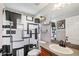 Bathroom featuring a black and white shower curtain, shelves, and dark wood vanity at 37113 Waldo Dr, Dade City, FL 33525