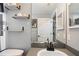 Bathroom with floating shelves, gray paint, and black faucet at 37113 Waldo Dr, Dade City, FL 33525