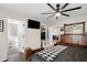 Spacious main bedroom with a ceiling fan, walk-in closet, and wood-look flooring at 37113 Waldo Dr, Dade City, FL 33525