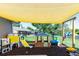 Backyard playground with playhouse, slide, swing and other outdoor play equipment at 37113 Waldo Dr, Dade City, FL 33525