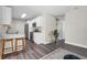 Well-lit kitchen featuring new stainless appliances, white cabinetry and adjacent seating at 3907 W Walnut St, Tampa, FL 33607