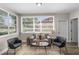 Relaxing living room with comfortable seating, large windows for natural light, and neutral decor at 3907 W Walnut St, Tampa, FL 33607