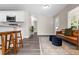 Bright and open living area features modern flooring and a smooth transition into the adjacent kitchen at 3907 W Walnut St, Tampa, FL 33607