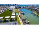 Stunning aerial view showcasing the rooftop amenities, pool, and boat docks with water views at 400 150Th Ave # 504, Madeira Beach, FL 33708