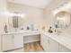 Elegant bathroom featuring double sinks, quartz countertops, a vanity and modern lighting at 400 150Th Ave # 504, Madeira Beach, FL 33708