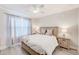 Neutral bedroom with a ceiling fan, hardwood floors, and a well-lit atmosphere at 400 150Th Ave # 504, Madeira Beach, FL 33708