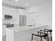 Modern kitchen featuring stainless steel appliances and eat in bar with sleek countertops at 400 150Th Ave # 504, Madeira Beach, FL 33708