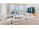Inviting living room with a balcony and comfortable seating area at 400 150Th Ave # 504, Madeira Beach, FL 33708