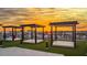 Beautifully designed rooftop lounge area with modern cabanas offering panoramic views at sunset at 400 150Th Ave # 504, Madeira Beach, FL 33708