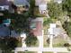 Aerial view of property with in-ground pool, lush greenery and neighborhood details near the water at 4317 S Hale Ave, Tampa, FL 33611