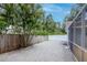 Backyard features a gravel base, wood fence, and some greenery at 4317 S Hale Ave, Tampa, FL 33611