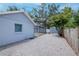 Backyard featuring a gravel base, and a pool area enclosed by screens at 4317 S Hale Ave, Tampa, FL 33611