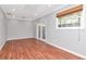 Bright bedroom features hardwood floors, recessed lights, and natural light from large windows at 4317 S Hale Ave, Tampa, FL 33611